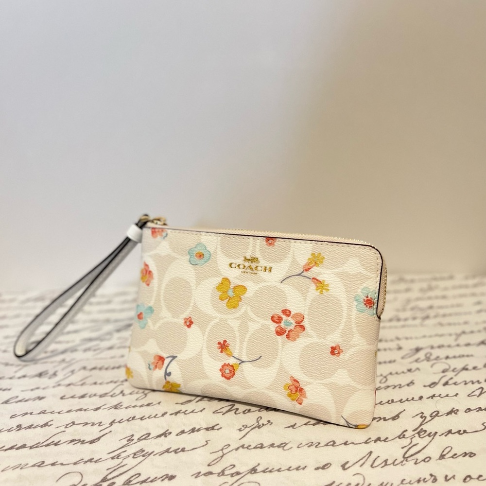 Coach Corner Zip Wristlet In Signature Canvas
With Mystical Floral Print